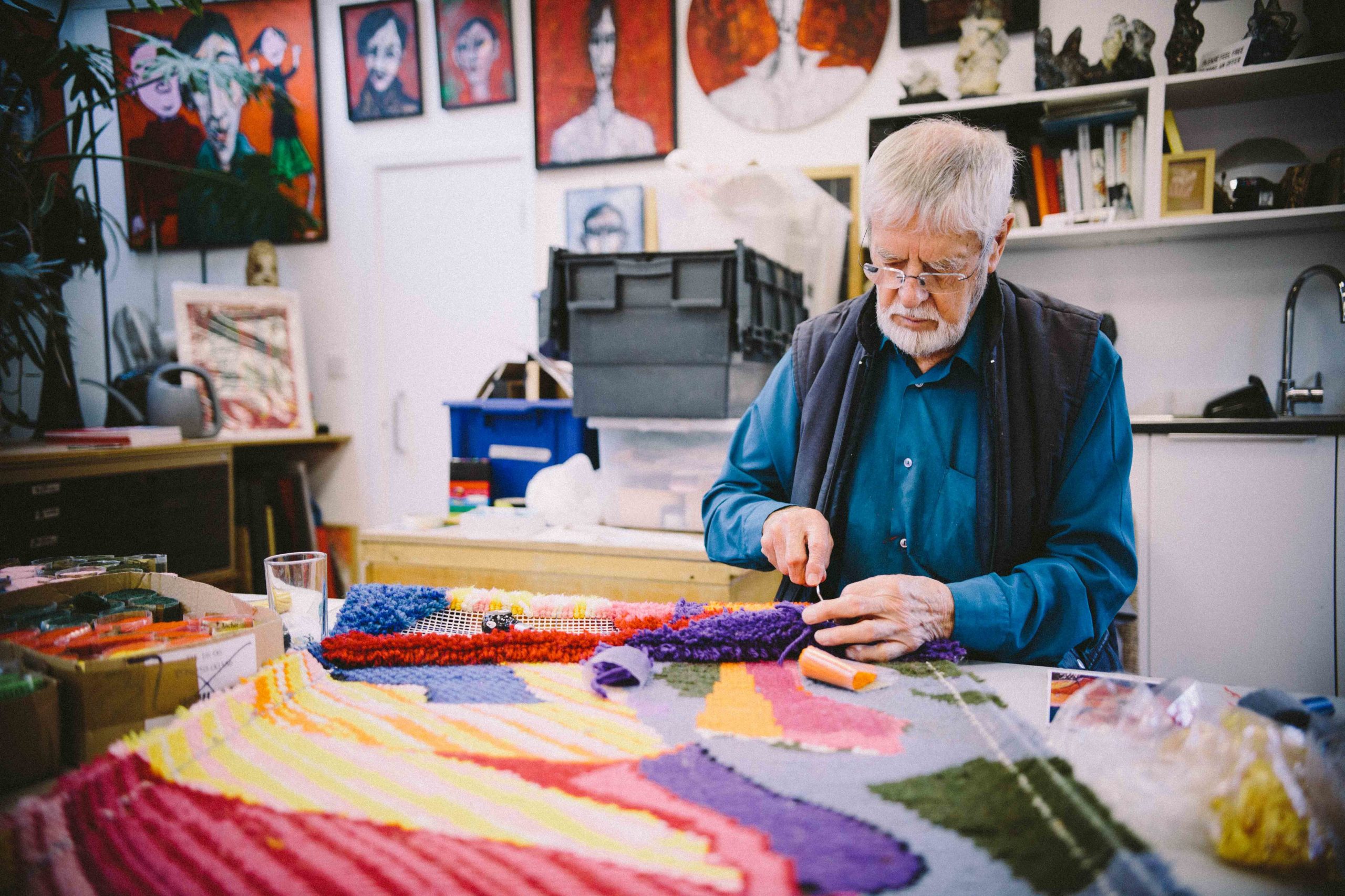 Keith Gretton knotting a wool rug