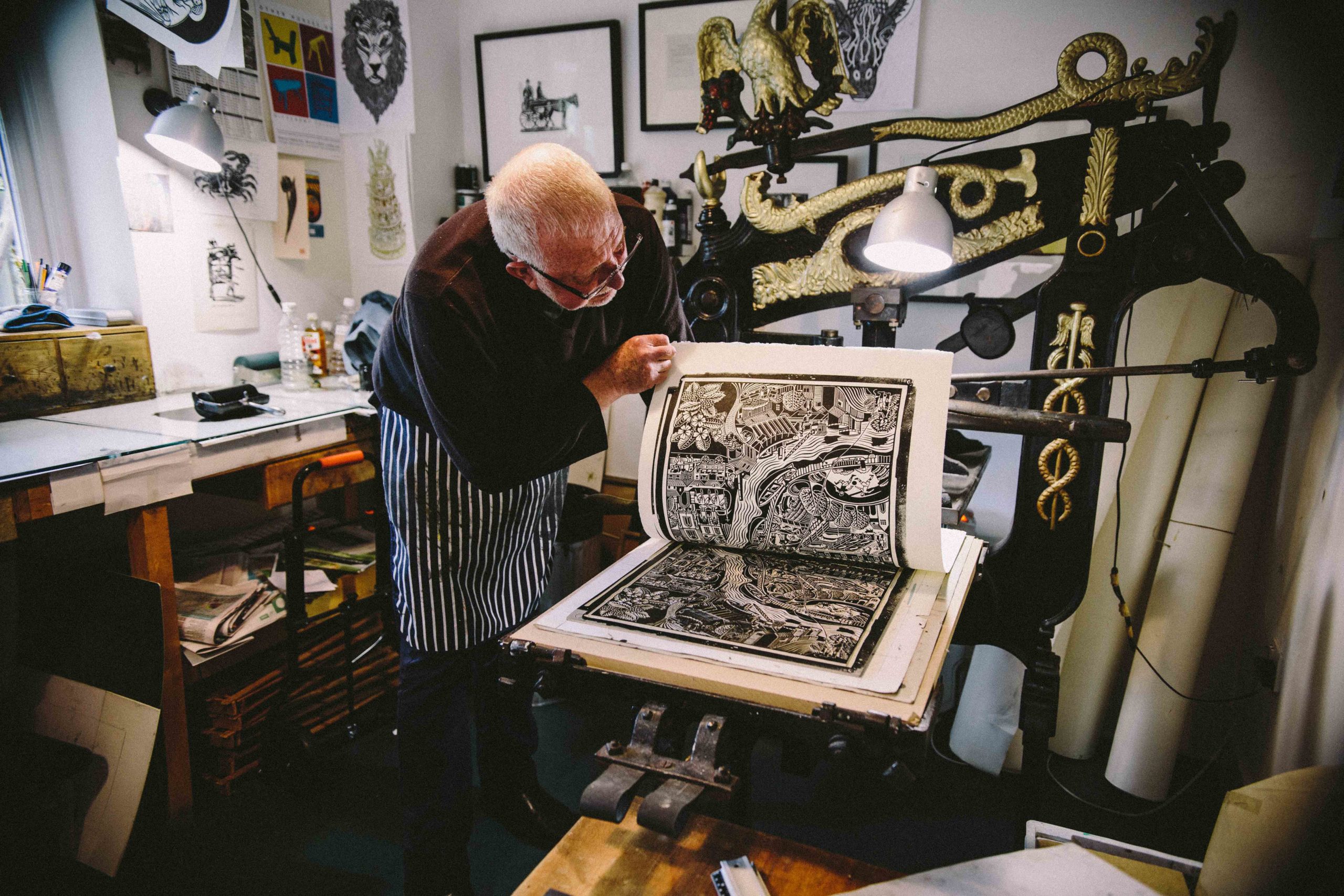 Hugh Ribbons printing a lino cut