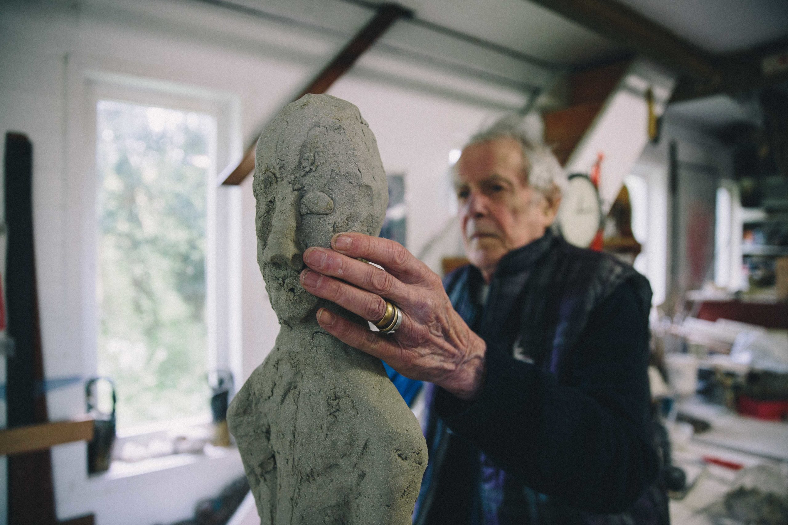 Ian Gregory sculpting a figure with clay