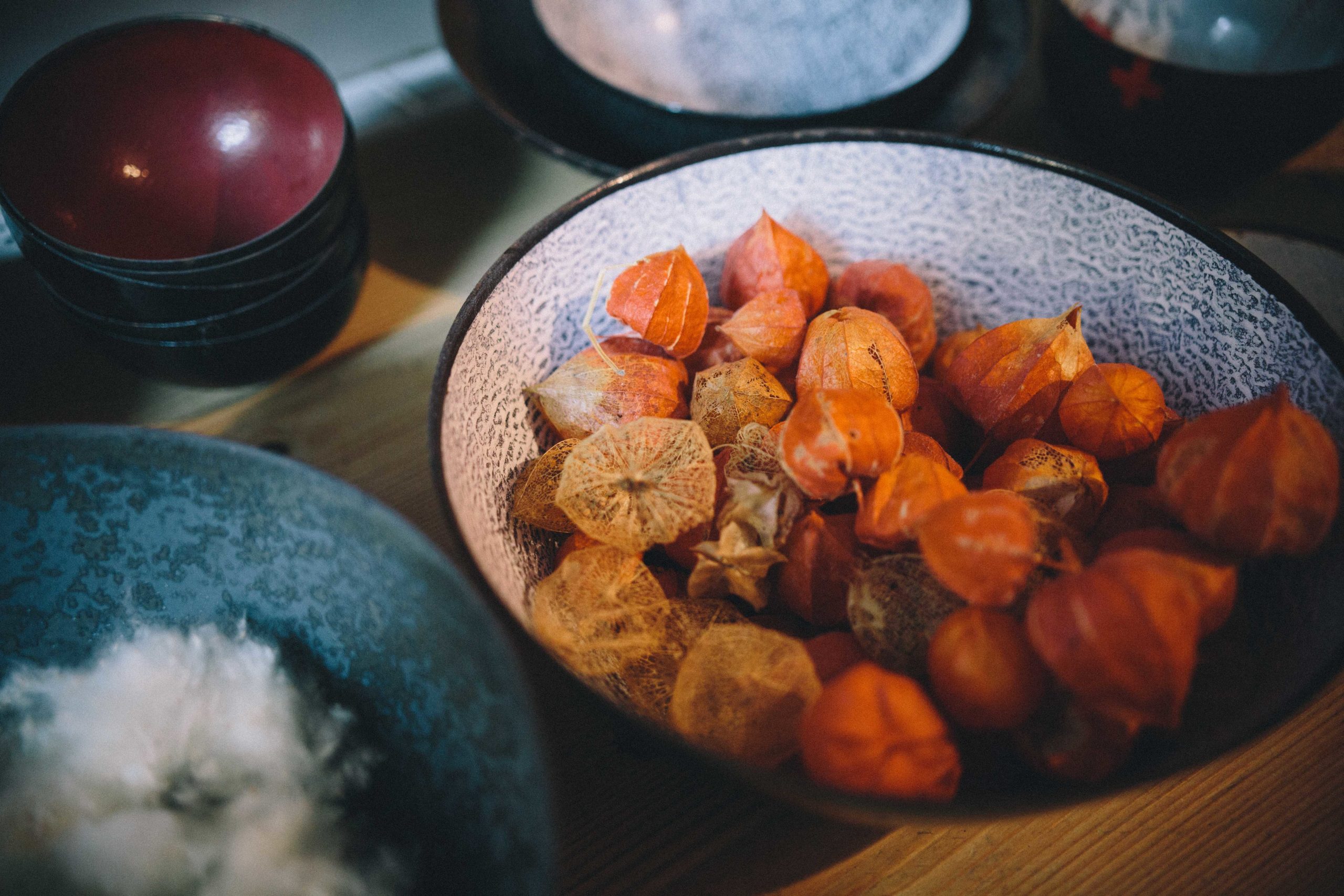 Bowls with red seed pods